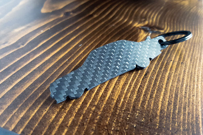 A 190E Evolution 1 carbon fiber keychain, rear view
