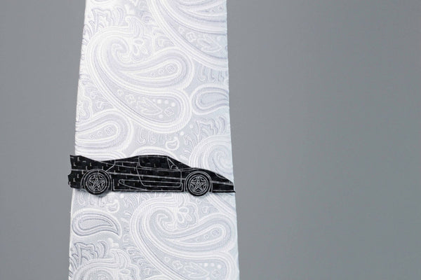 F50 carbon fiber tie clip on a silver tie. Perfect for any car lover.