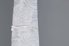 F50 carbon fiber tie clip, reflecting light on a silver tie. Perfect for any car lover.