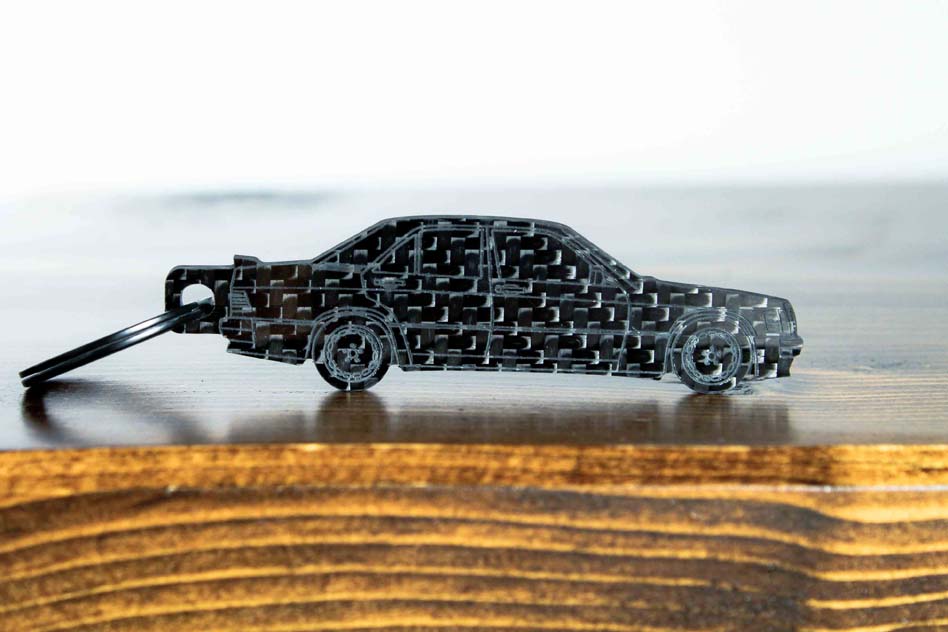 A 190E 2.3 16 valve carbon fiber keychain, front view