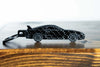 An MK4 Supra carbon fiber keychain, front view