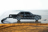 An E30 Coupe carbon fiber keychain, front view
