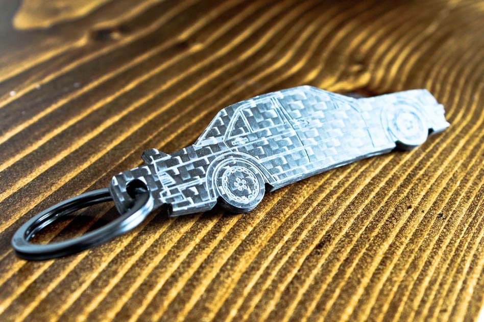A 190E Evolution 1 carbon fiber keychain, angle view