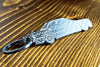 A 190E Evolution 1 carbon fiber keychain, angle view