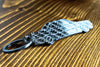 A 190E 2.3 16 valve carbon fiber keychain, angle view