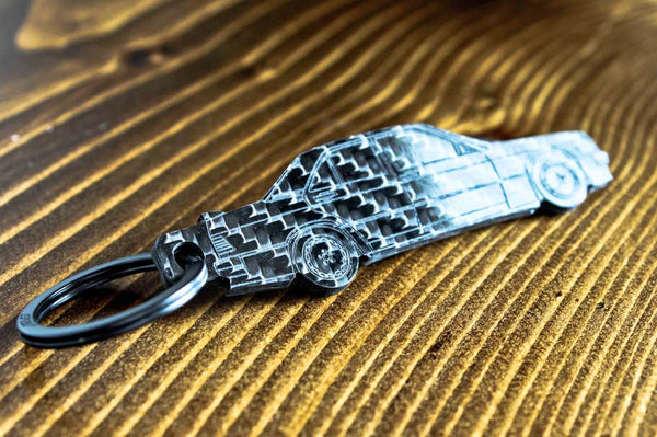 A 190E 2.3 16 valve carbon fiber keychain, angle view