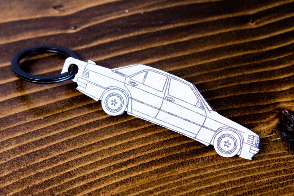 A 190E 2.3 16 valve carbon fiber keychain, line detail view