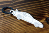 An MK4 Supra carbon fiber keychain, line detail view