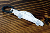An FD RX-7 carbon fiber keychain, line detail view