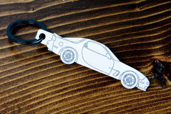 An FD RX-7 carbon fiber keychain, line detail view