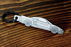 An NSX carbon fiber keychain, line detail view