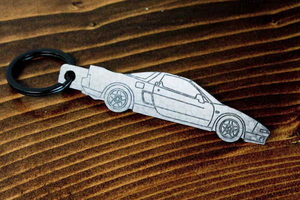 An NSX carbon fiber keychain, line detail view