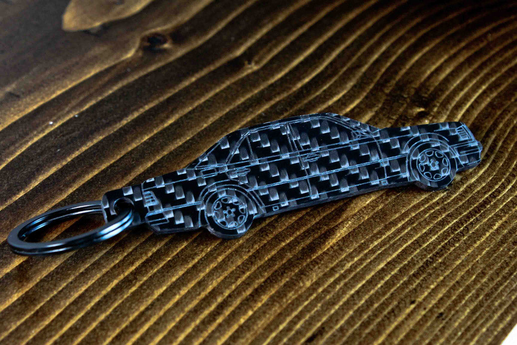A W124 500E carbon fiber keychain, angle view