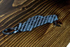 An R34 GTR carbon fiber keychain, angle view