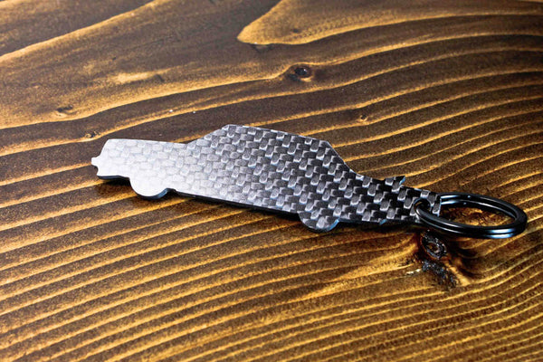 A 242 Turbo Evolution carbon fiber keychain, rear view