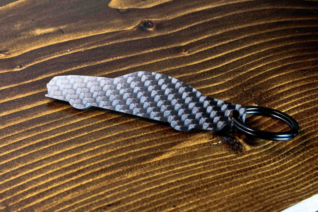 An SL65 Black Series carbon fiber keychain, rear view