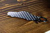 An SL65 Black Series carbon fiber keychain, rear view