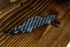 A Sport Quattro carbon fiber keychain, angle view