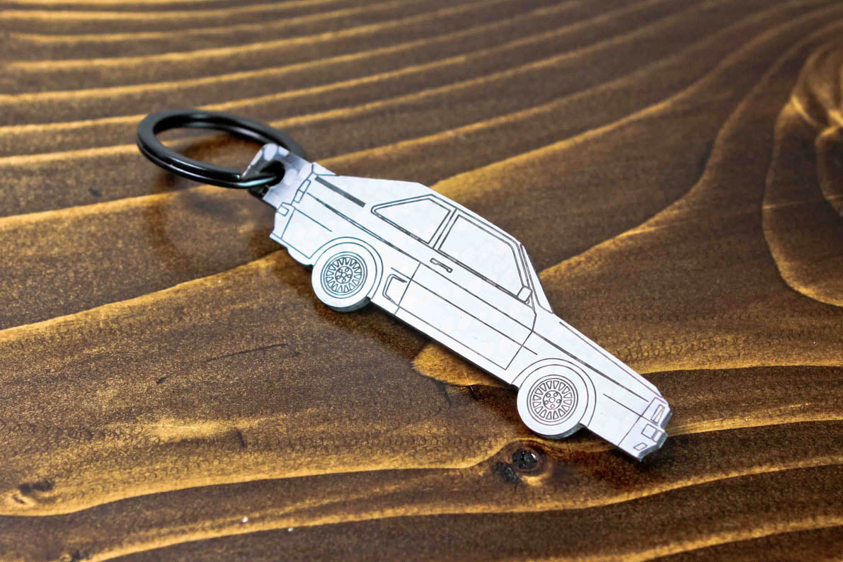 A Sport Quattro carbon fiber keychain, line detail view