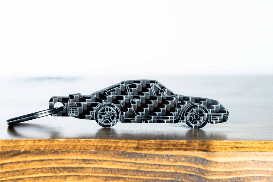 A 959 carbon fiber keychain, front view