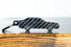 A Sport Quattro carbon fiber keychain, front view