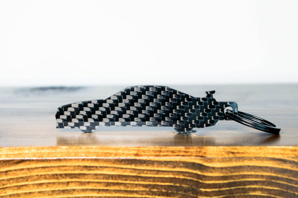 An R34 GTR carbon fiber keychain, rear view