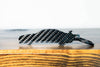 An R34 GTR carbon fiber keychain, rear view
