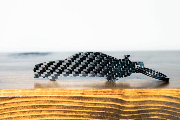 An R34 GTR carbon fiber keychain, rear view