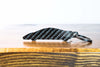 An F1 carbon fiber keychain, rear view