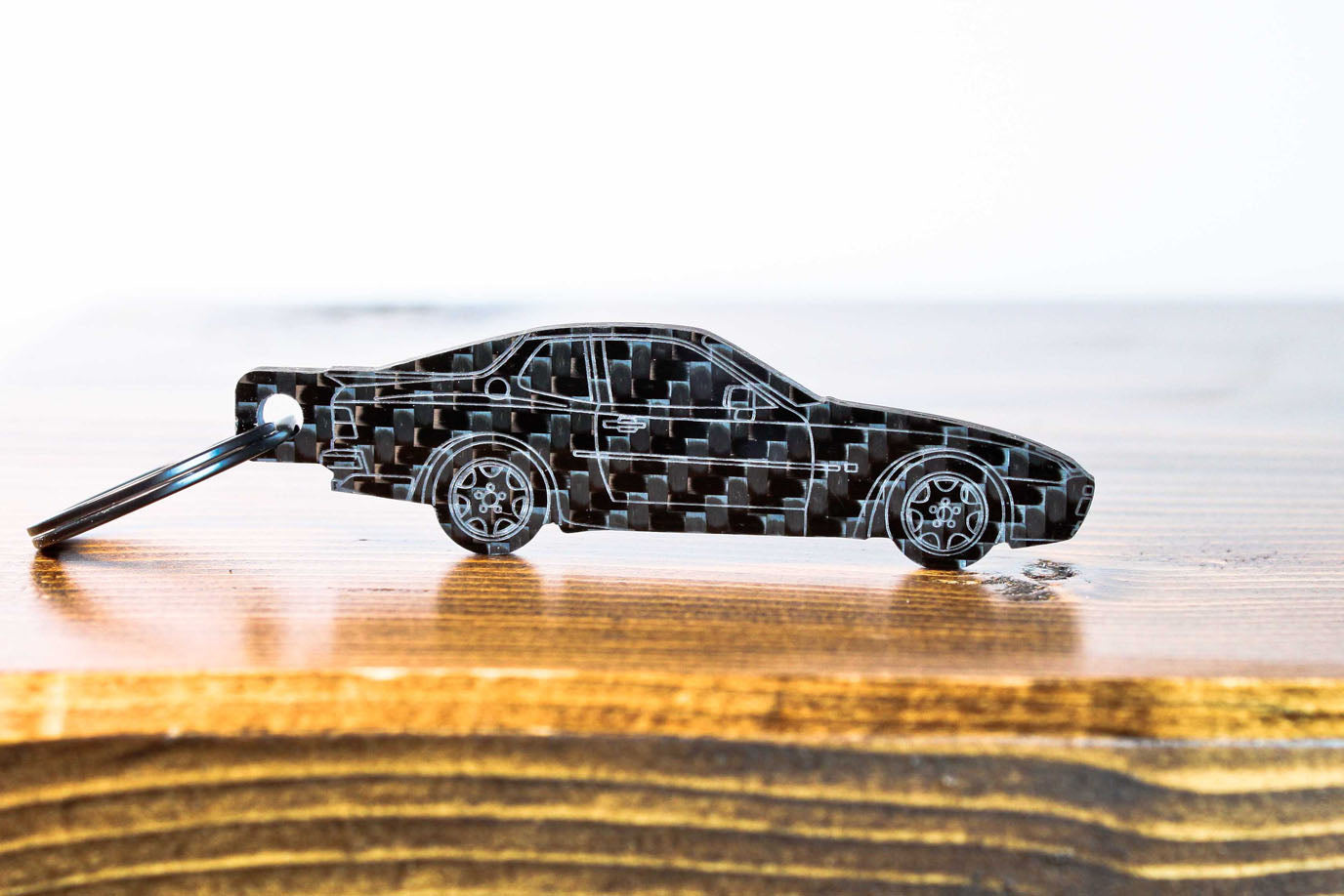 A 944 Turbo carbon fiber keychain, front view