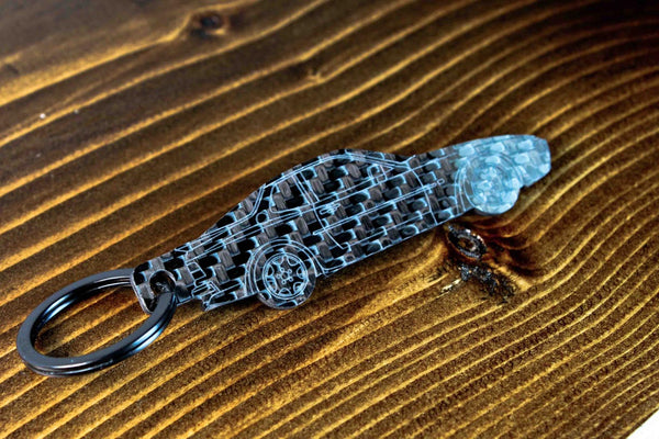 A 944 Turbo carbon fiber keychain, angle view