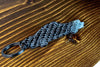 A 911 930 Turbo carbon fiber keychain, angle view