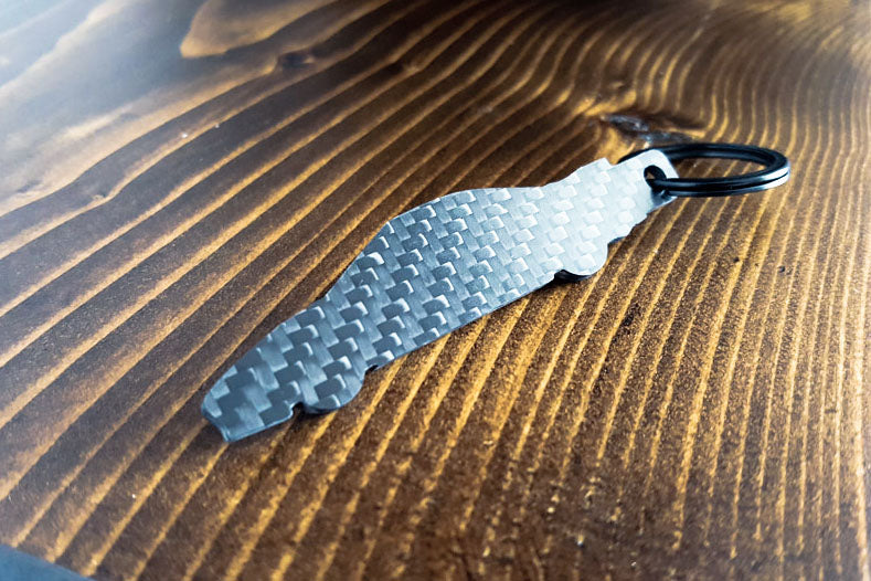 An NSX carbon fiber keychain, rear view