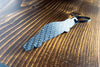 An NSX carbon fiber keychain, rear view