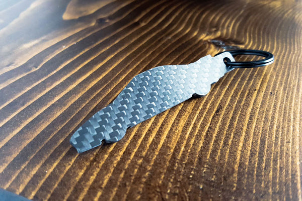An NSX carbon fiber keychain, rear view
