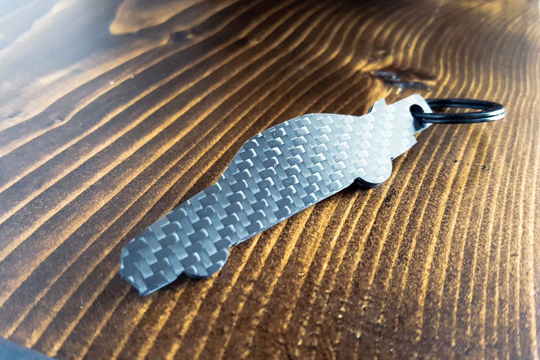 An R32 GTR carbon fiber keychain, rear view