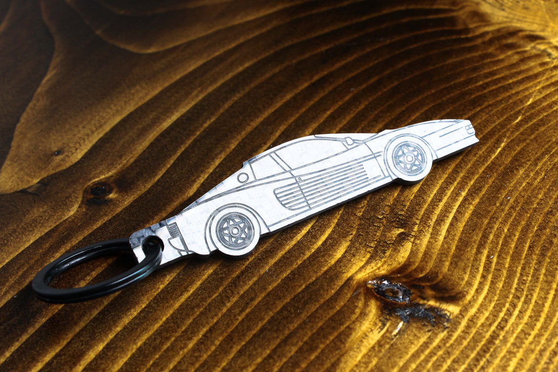 Testarossa carbon fiber keychain, reflecting light