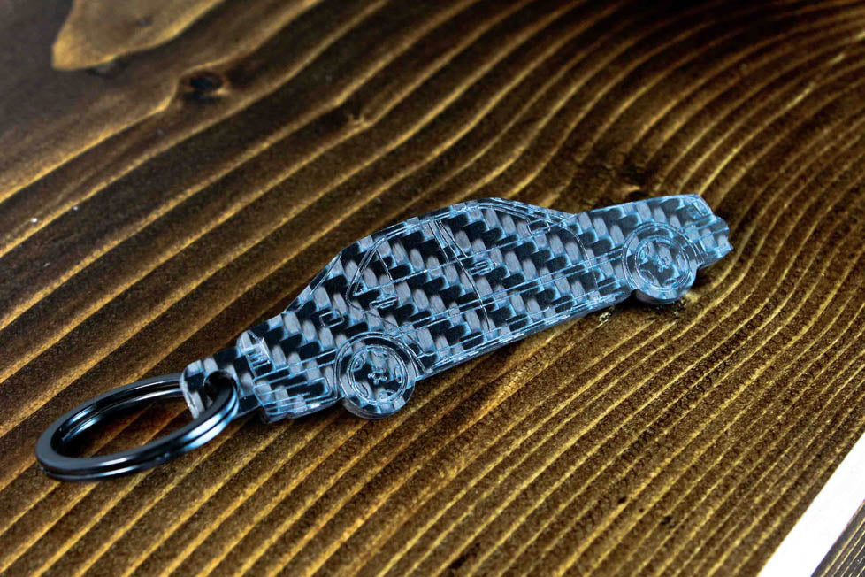 A C36 AMG carbon fiber keychain, angle view