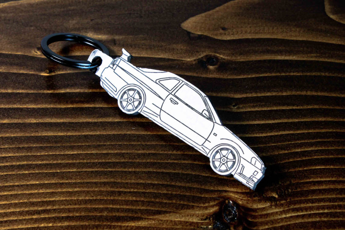 An R34 GTR carbon fiber keychain, line detail view