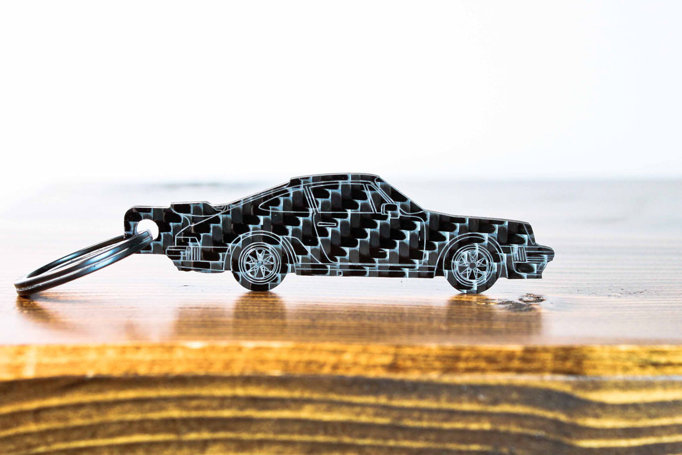 A 911 930 Turbo carbon fiber keychain, front view