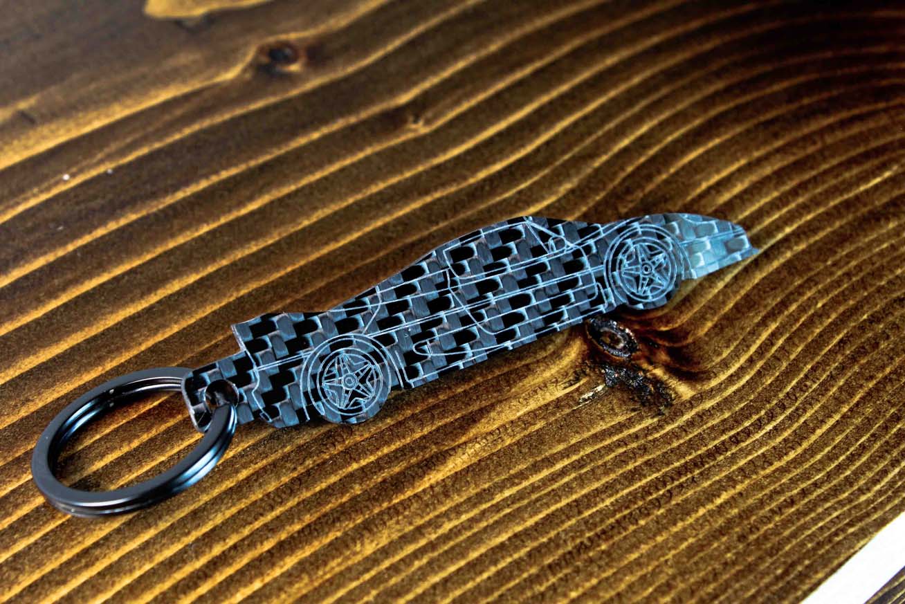 An F50 carbon fiber keychain, angle view
